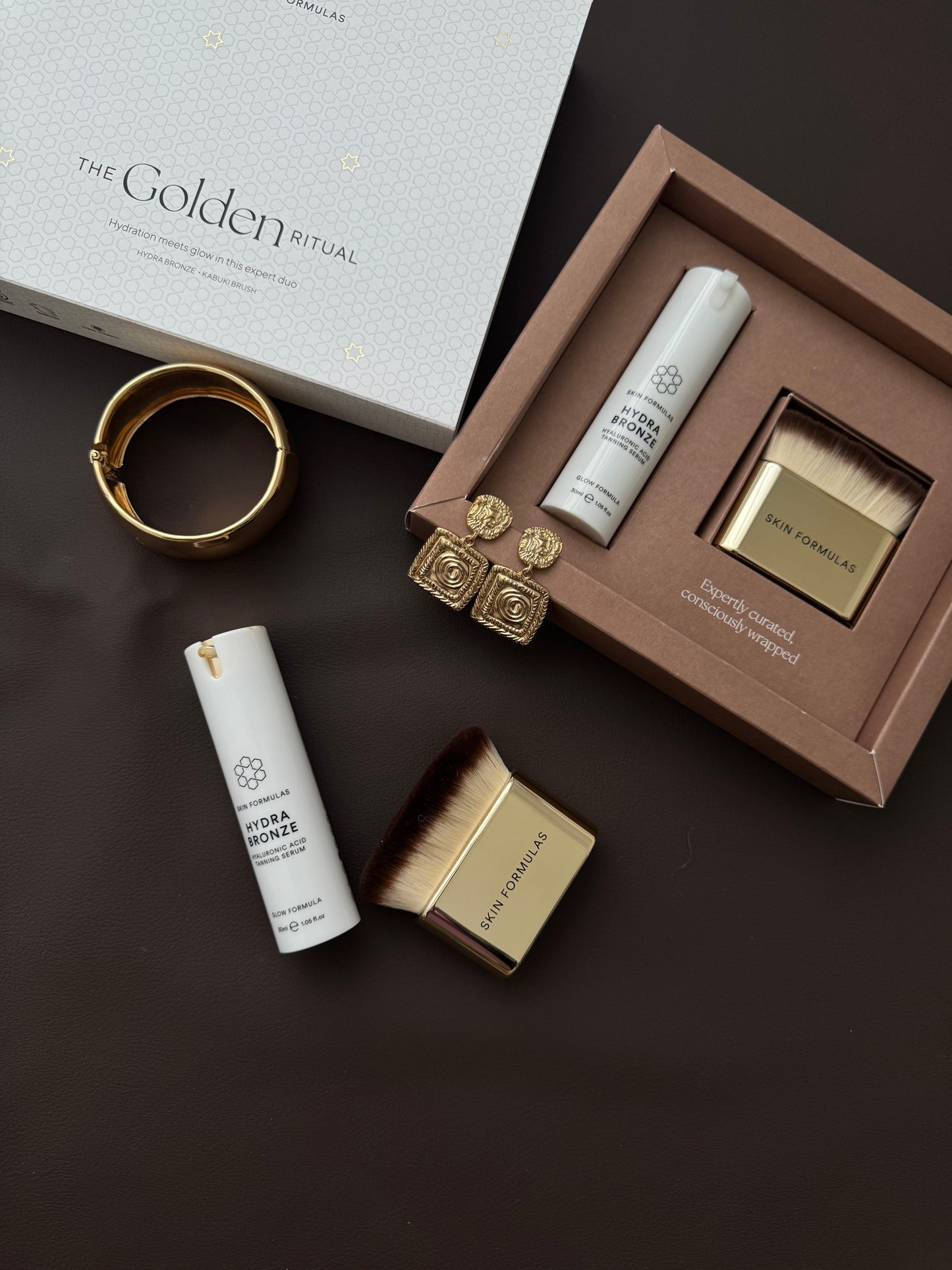SAVAIMINIO ĮDEGIO SERUMAS IR KABUKI ŠEPETĖLIS, “THE GOLDEN RITUAL” - SKINBIO.lt