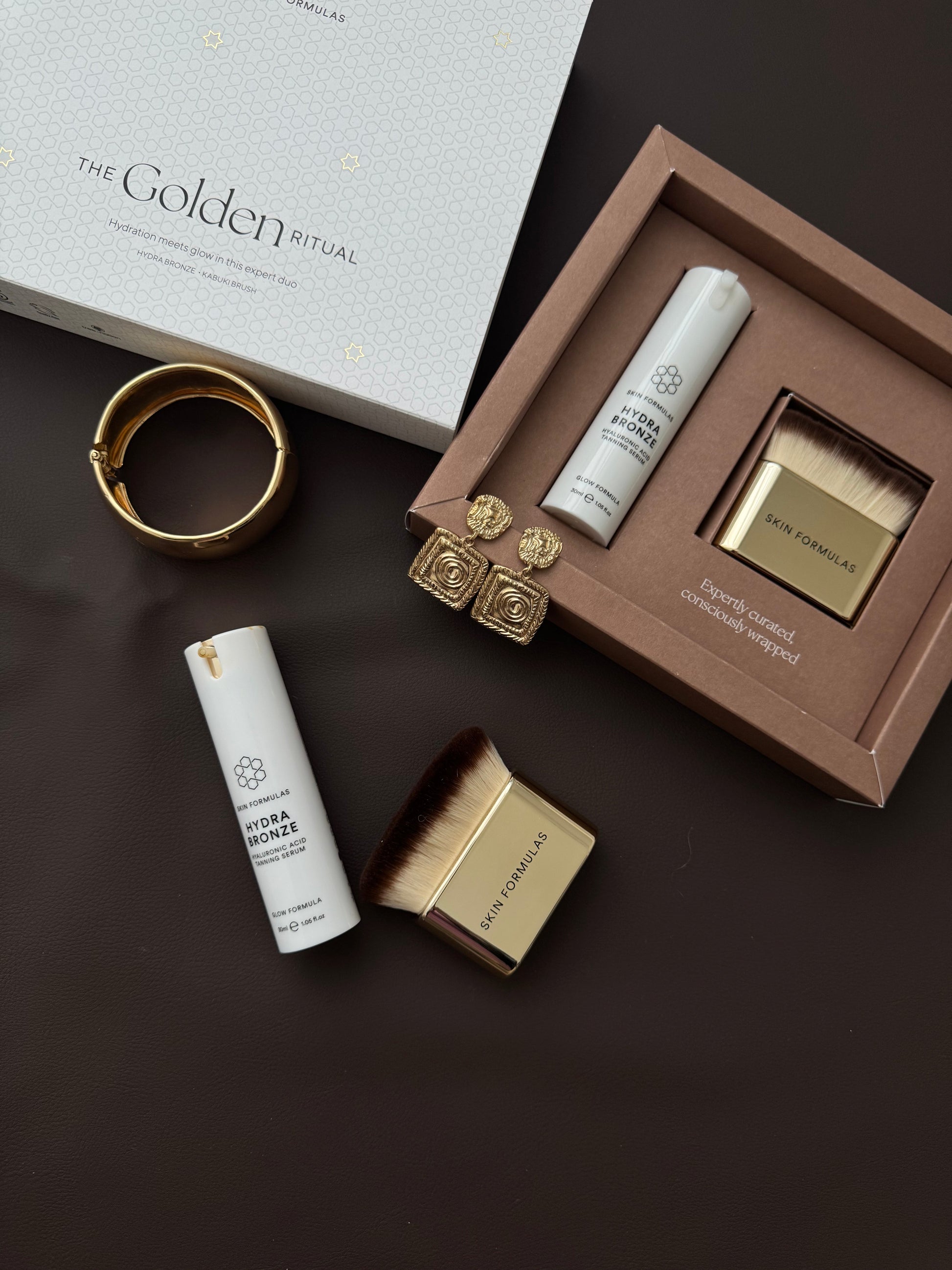 SAVAIMINIO ĮDEGIO SERUMAS IR KABUKI ŠEPETĖLIS, “THE GOLDEN RITUAL” - SKINBIO.lt